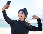 Fitness, woman and beach with smile for selfie, profile picture or social media post in muscle flex. Happy sporty female vlogger or influencer smiling for photo memory, exercise or workout outdoors