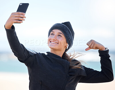Buy stock photo Fitness, woman and beach with smile for selfie, profile picture or social media post in muscle flex. Happy sporty female vlogger or influencer smiling for photo memory, exercise or workout outdoors