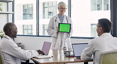 Buy stock photo Green screen, tablet presentation and doctors meeting for hospital research, results and software clinic solution. Medical professional, mockup space and senior woman success with stakeholder people