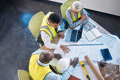 Buy stock photo Architect, laptop and team in meeting above for construction or building planning strategy at office. Group of diverse engineers discussing floor plan, project layout or blueprints for architecture