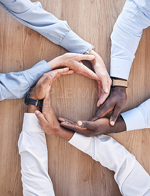 Buy stock photo Business people, hands together and staff circle showing work community, solidarity and trust. Motivation, team building and collaboration gesture above of office workers with teamwork and diversity