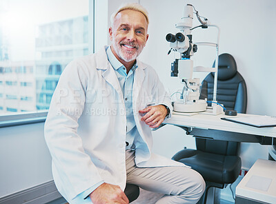 Buy stock photo Optometry, healthcare and portrait of a male optometrist sitting by equipment in a optical clinic. Vision, medical and senior man eye care specialist with a retinoscope machine in a optic store.