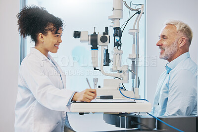 Buy stock photo Vision, eye test and healthcare with a doctor woman or optometrist testing the eyes of a man patient in a clinic. Hospital, medical or consulting with a female eyesight specialist and senior male