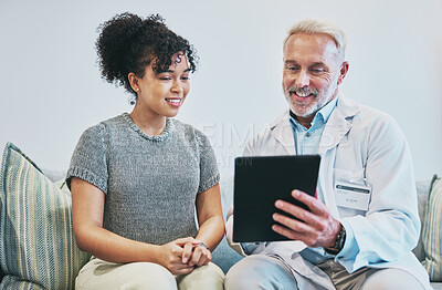 Buy stock photo Doctor, patient and man with tablet for consultation, checkup or health results in home visit. Healthcare, technology and senior medical professional with happy black woman for wellness appointment.