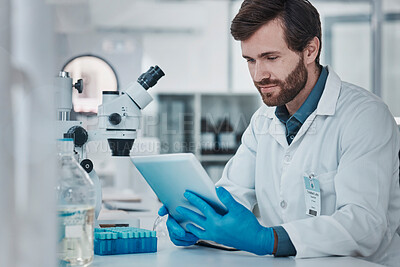 Buy stock photo Science, medical research and man with tablet in laboratory checking results, internet or email online. Healthcare, medicine and innovation in vaccine manufacturing, scientist reading journal website