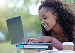 Laptop, books and education with a student black woman on campus at university to study, learn or research. Computer, internet and learning with a female college pupil studying outside on a field