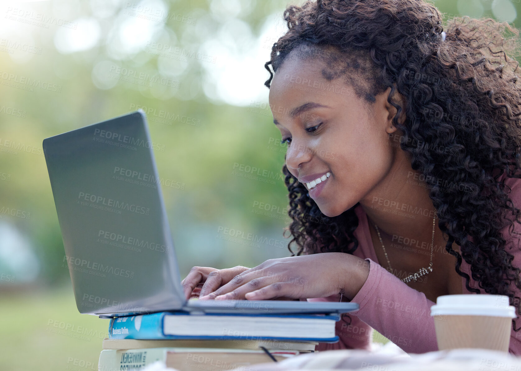 Buy stock photo Laptop, books and education with a student black woman on campus at university to study, learn or research. Computer, internet and learning with a female college pupil studying outside on a field