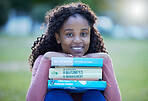 Books, portrait and black woman at park or university campus for learning, studying and reading knowledge. Face of young person or student and textbook for business college, scholarship and education
