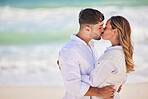 Hug, beach or couple love to kiss on holiday vacation or romantic honeymoon to celebrate marriage commitment. Travel, trust or woman bonding, kissing or hugging partner in fun summer romance at sea