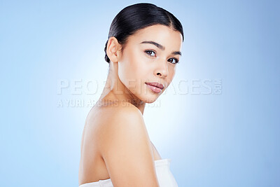 Buy stock photo Portrait, beauty and mockup with a model black woman in studio isolated on blue background for skincare. Face, aesthetic or spa and an attractive young female posing with blank or empty mock up space