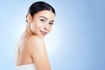 Buy stock photo Face, aesthetic and mockup with a model black woman in studio on a blue background for skincare. Portrait, beauty and spa with an attractive young female isolated on blank or empty mock up space