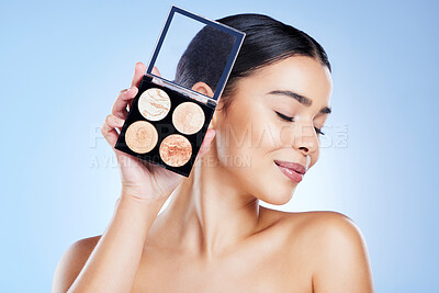 Buy stock photo Makeup, beauty and face of woman with palette on blue background for cosmetics, powder and foundation. Skincare, cosmetology and girl with highlighter for glowing skin, self care and luxury style