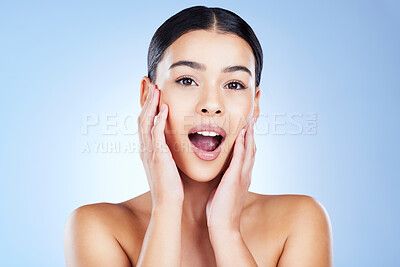 Buy stock photo Skincare, shock and portrait of a woman in a studio with a beauty, natural and face routine. Surprise, health and female model from Brazil with a shocking facial treatment isolated by blue background
