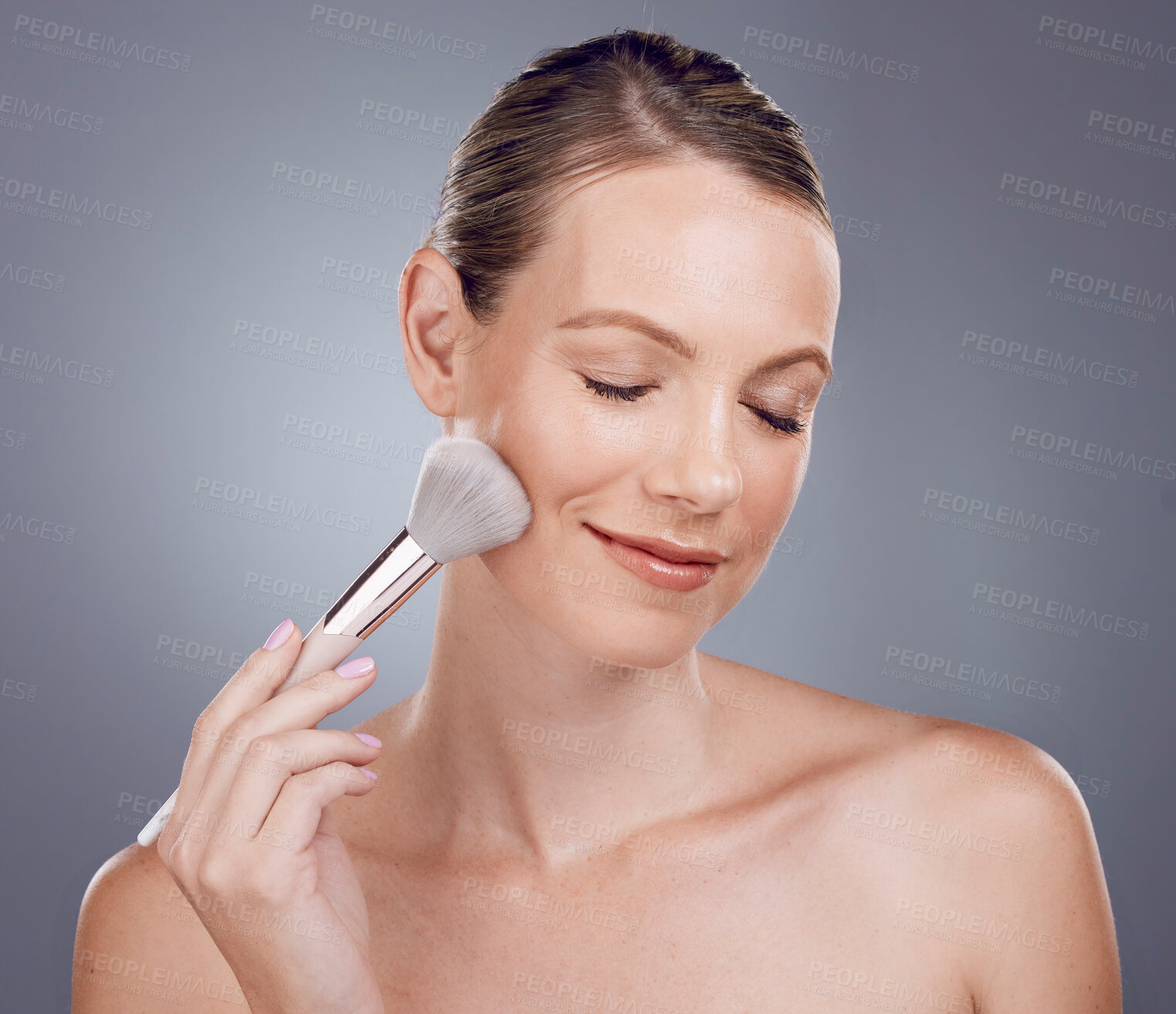 Buy stock photo Face, brush for makeup and woman, beauty and skin glow with content and foundation on studio background. Powder, cosmetics tools and skincare with shine, cosmetology and satisfied with cosmetic care 