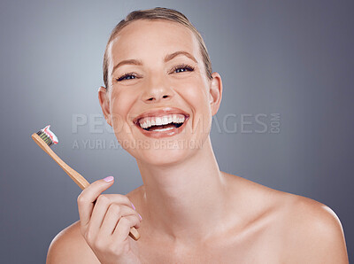 Buy stock photo Bamboo toothbrush, happy portrait and woman for dental wellness, healthy cleaning and face cosmetics. Female teeth, eco wooden brush and toothpaste for mouth smile, mature model and studio background