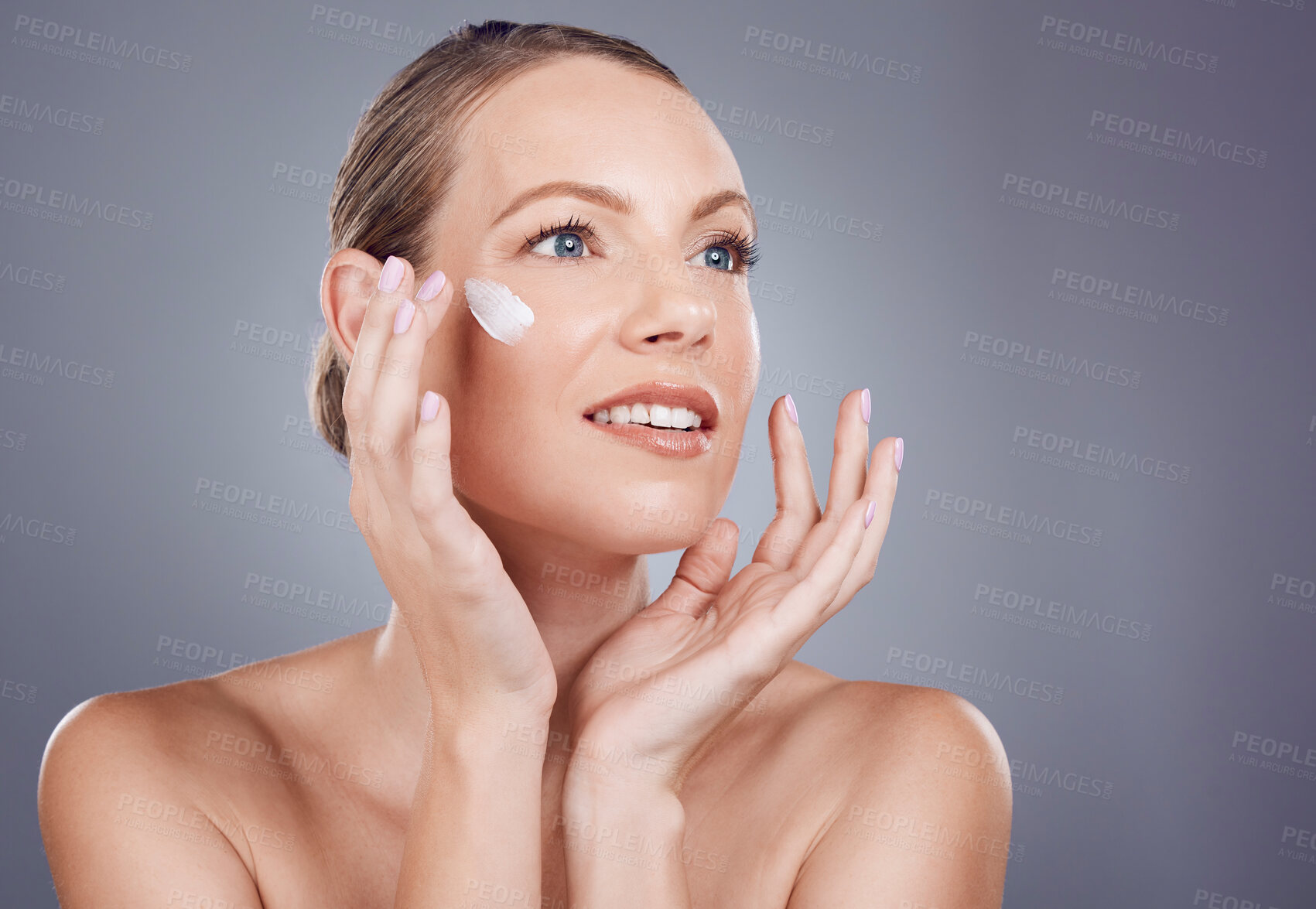 Buy stock photo Skincare, cream and face of woman for beauty on gray background for wellness, cosmetics and facial treatment. Luxury spa, dermatology and happy girl with lotion, moisturizer and anti aging products