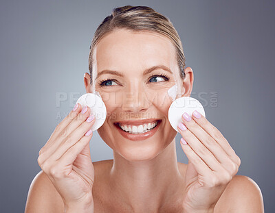 Buy stock photo Skincare, cotton pad and face of woman on gray background for wellness, cosmetics and facial treatment. Beauty, dermatology and happy girl with patches for makeup removal, spa products and cleaning