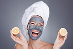 Lemon mask, clay and woman for healthy facial, beauty portrait and anti aging wellness makeup in studio. Happy female model, citrus fruits and vitamin c for charcoal product, shower and laughing face