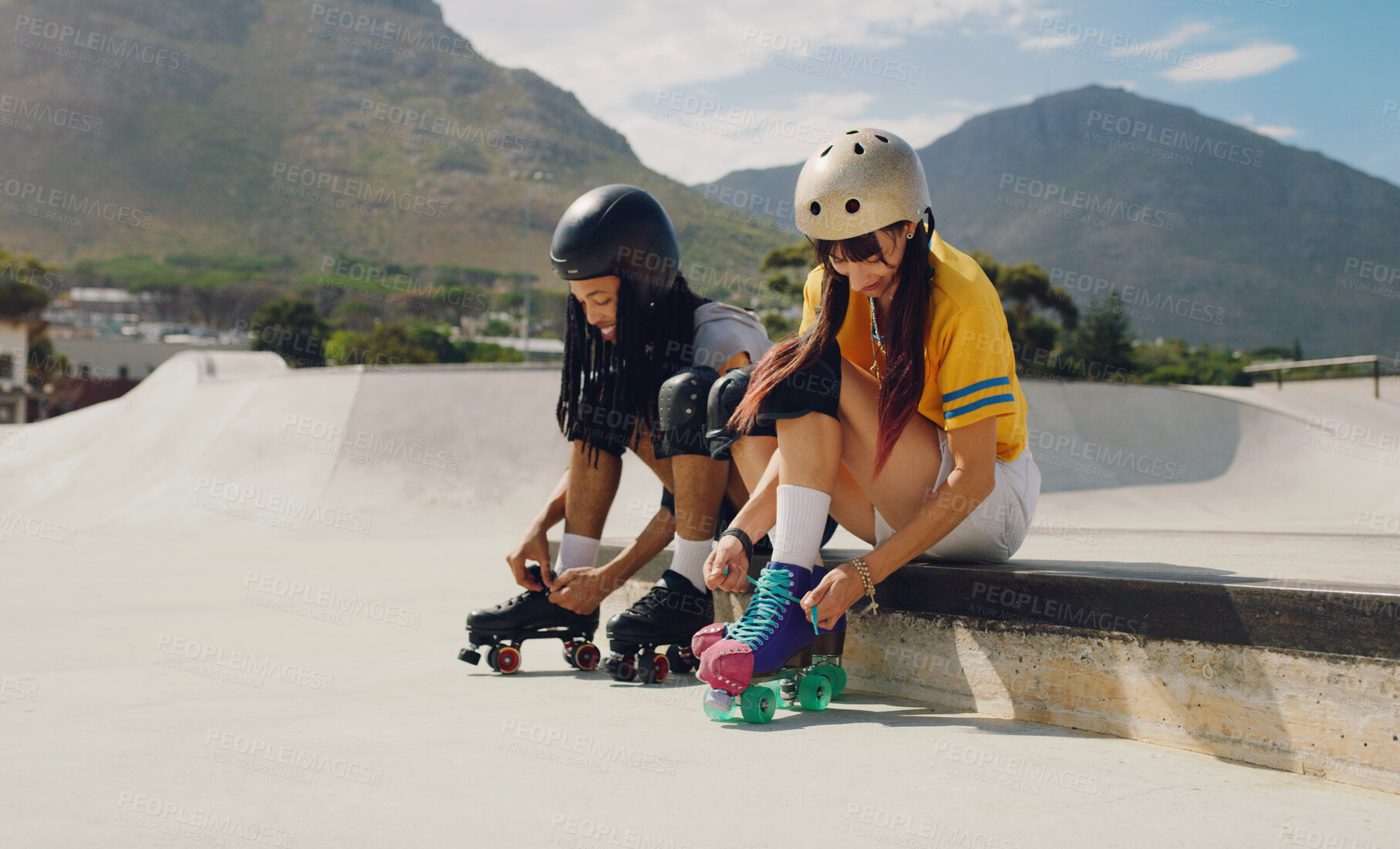 Buy stock photo Friends at skate park, urban and rollerblading with sports outdoor, fun and ready for skating in city with helmet for safety. Young, black man and woman with exercise, extreme sport and lifestyle