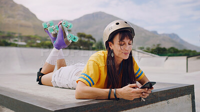Buy stock photo Social media, chat and woman on a phone while rollerskating for communication and connection in park. Digital, internet and girl reading a message on a mobile app while at a park to skate for sports