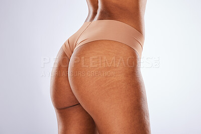 Buy stock photo Underwear, butt and black woman isolated on a white background for beauty empowerment, aesthetic or cellulite. Lingerie, body and skincare of a model with ass stretch marks or dermatology in studio