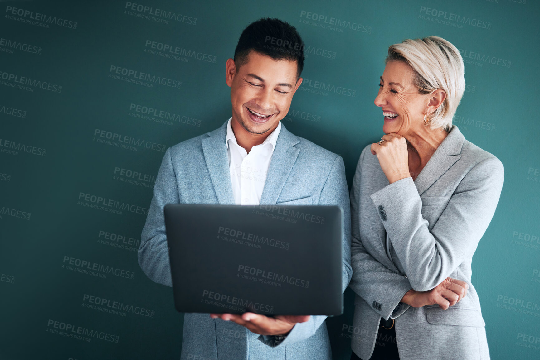 Buy stock photo Laptop, teamwork and planning with a business team in studio on a green background for strategy. Computer, collaboration or management with a man and woman working on growth as company leadership