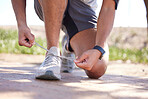 Fitness, exercise and man tie shoes ready to start running, marathon training and endurance workout. Sports, nature trail and feet of male runner tying shoelace for wellness, health and performance