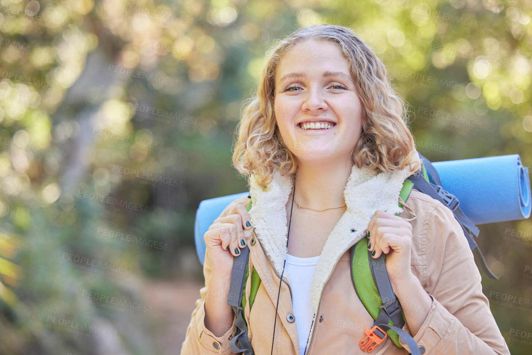 Buy stock photo Hiking, smile and portrait of woman with backpack, sun and freedom, hiker on trekking adventure in nature. Health, fitness and camping, happy face of gen z person on hike in mountain or forest of USA