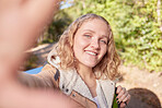 Woman, hiking portrait and forrest with selfie for freedom, peace or outdoor exercise adventure. Gen z explorer girl, face or excited smile for fitness, wellness and mindset in woods on summer walk