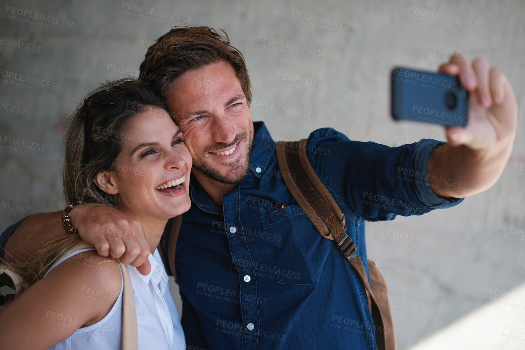 Buy stock photo Travel, selfie and smile of couple on vacation, holiday or trip in city, street or town outdoors. Photographer, love and man and woman laughing and taking pictures for happy memory or social media