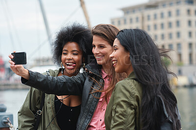 Buy stock photo Selfie, travel or bonding with tourist friends taking a picture outdoor together in a foreign city abroad. Happy, smile or diversity with a group of women overseas on vacation posting on social media