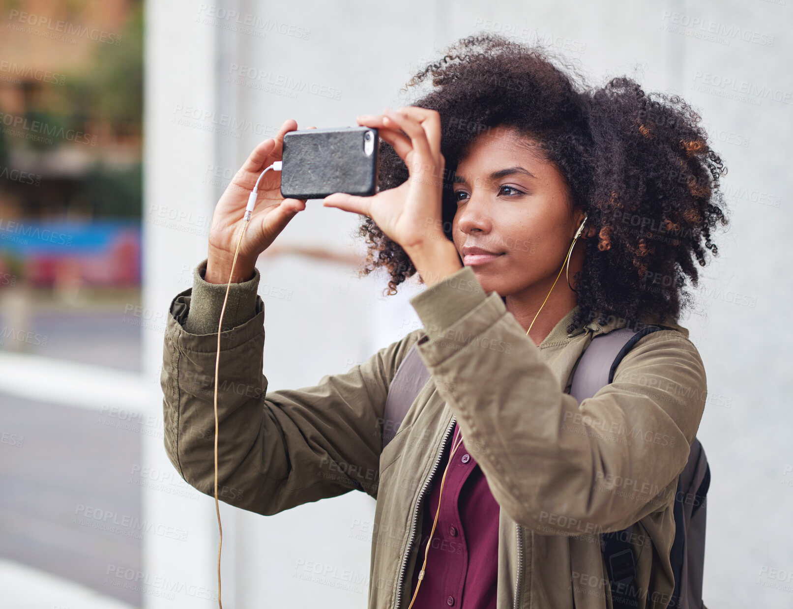 Buy stock photo Music earphones, selfie and black woman in city taking pictures for travel memory outdoors. Profile picture, street and female student taking photo for social media post while streaming radio podcast