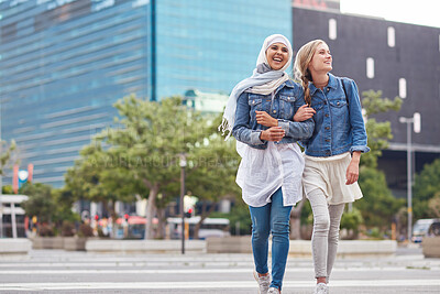 Buy stock photo Walking, bonding and friends in the city street on the weekend for quality time and fun. Diversity, laughing and women crossing the road on an urban walk together during travel and exploration
