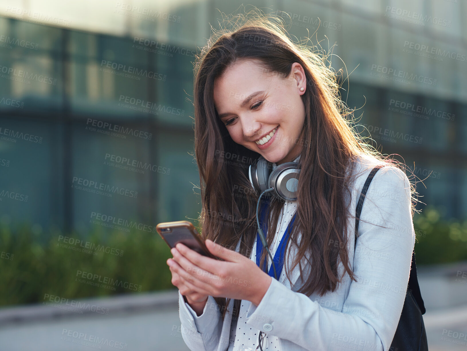 Buy stock photo Business woman, phone and smile for communication, social media or texting and chatting in city. Happy female typing and smiling on smartphone for 5G connection, mobile app or browsing in networking