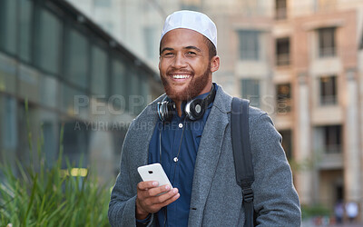 Buy stock photo Portrait, phone and muslim with an man in the city on his morning commute listening to music during the day. Mobile, contact and tradition with a happy islamic male walking alone in an urban town