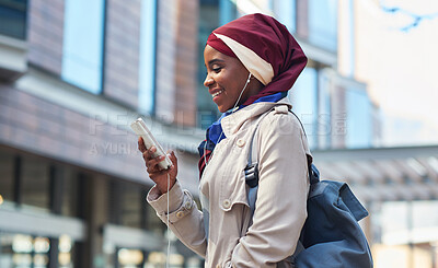 Buy stock photo Social media, music and Muslim woman with a phone in the city for 5g connection, internet and chat. Communication, streaming and Islamic girl typing and reading on a mobile with a podcast in town