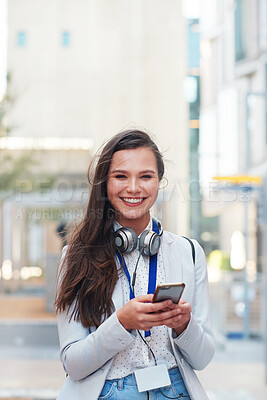 Buy stock photo Phone, happy and portrait of a woman in the city walking to her office while networking online. Happiness, smile and female browsing on social media, mobile app or internet while commuting to work.