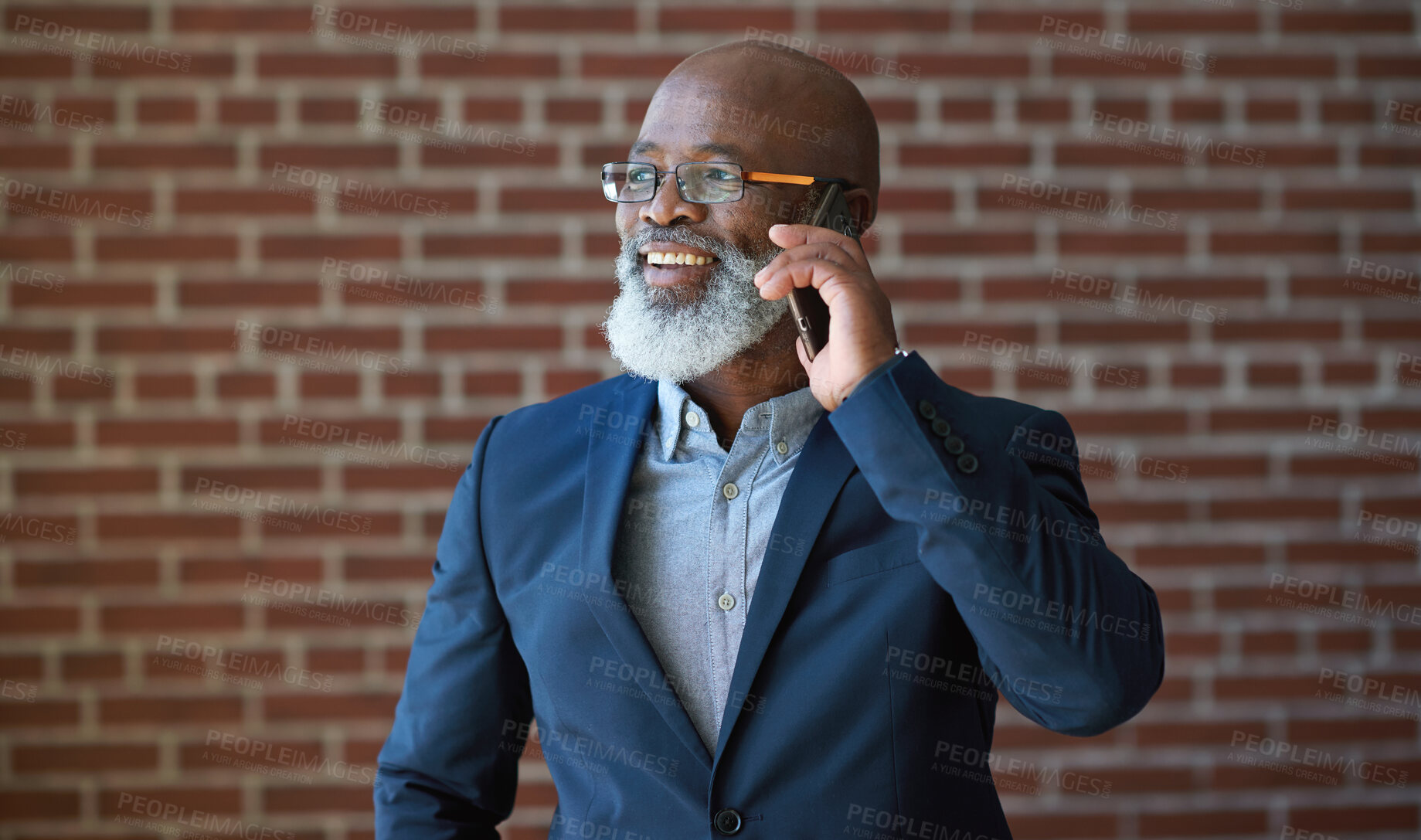 Buy stock photo Phone call of business black man on brick wall for communication, networking success or news. Happy professional manager, senior executive or boss talking on smartphone for investment opportunity