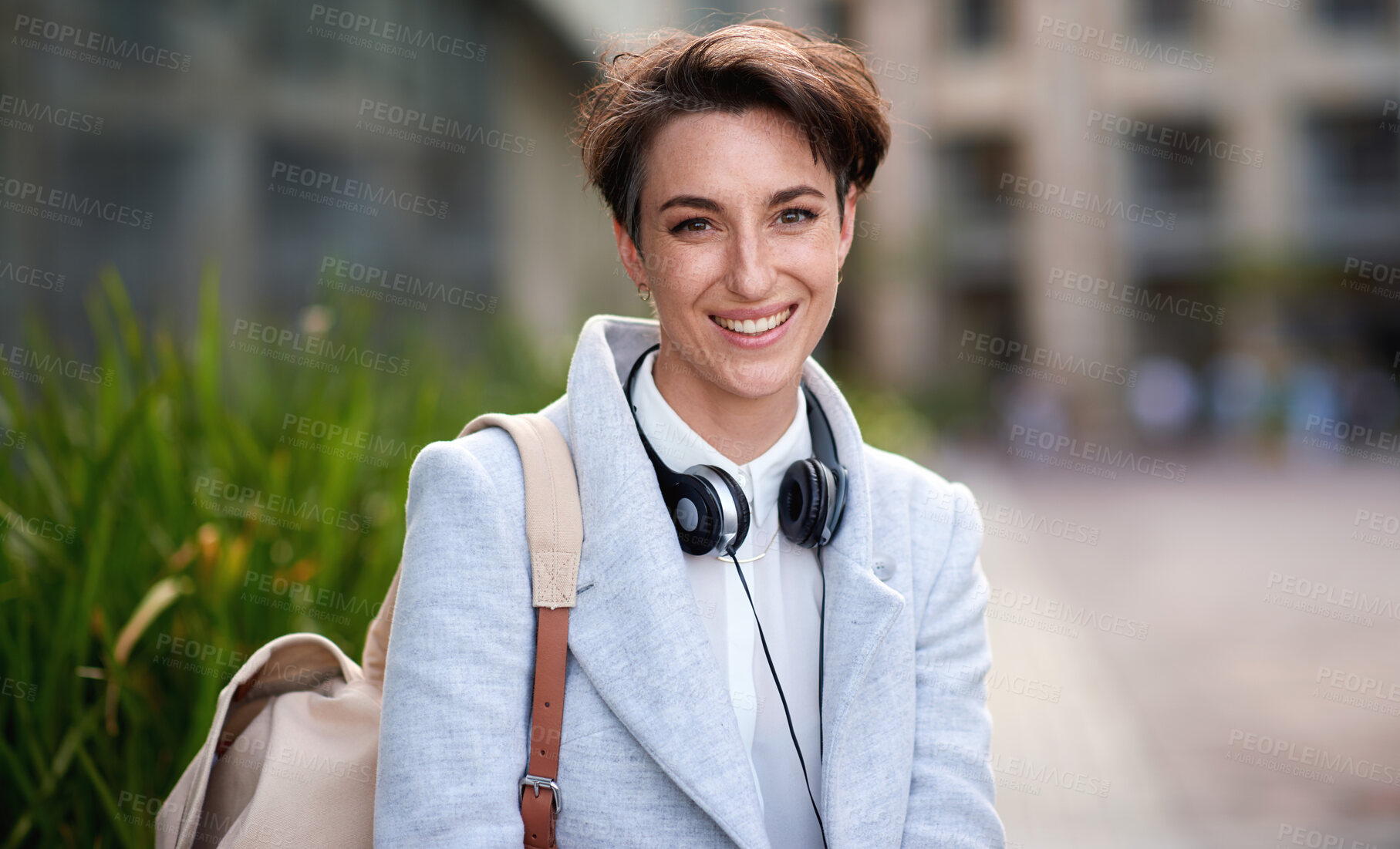 Buy stock photo Business woman, smile in portrait outdoor, young creative in city with success, happy and travel to work. Mockup, headshot and professional with headphones, content creator or web designer in Boston