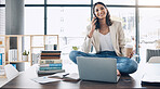 Employee, laptop or phone call and sitting on desk in relax startup, marketing company or advertising business. Smile, happy or talking woman on mobile communication technology, laptop or books study