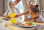 Fruit juice, family dinner and girl with father and orange drink at table with lunch food. Dad, children and senior people together with love, care and parent support ready for eating with a smile