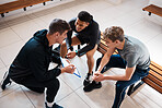 Sports, coach and men in locker room with strategy for game practice, exercise and training in gym. Personal trainer, fitness club and male athletes planning, prepare and talking for workout routine