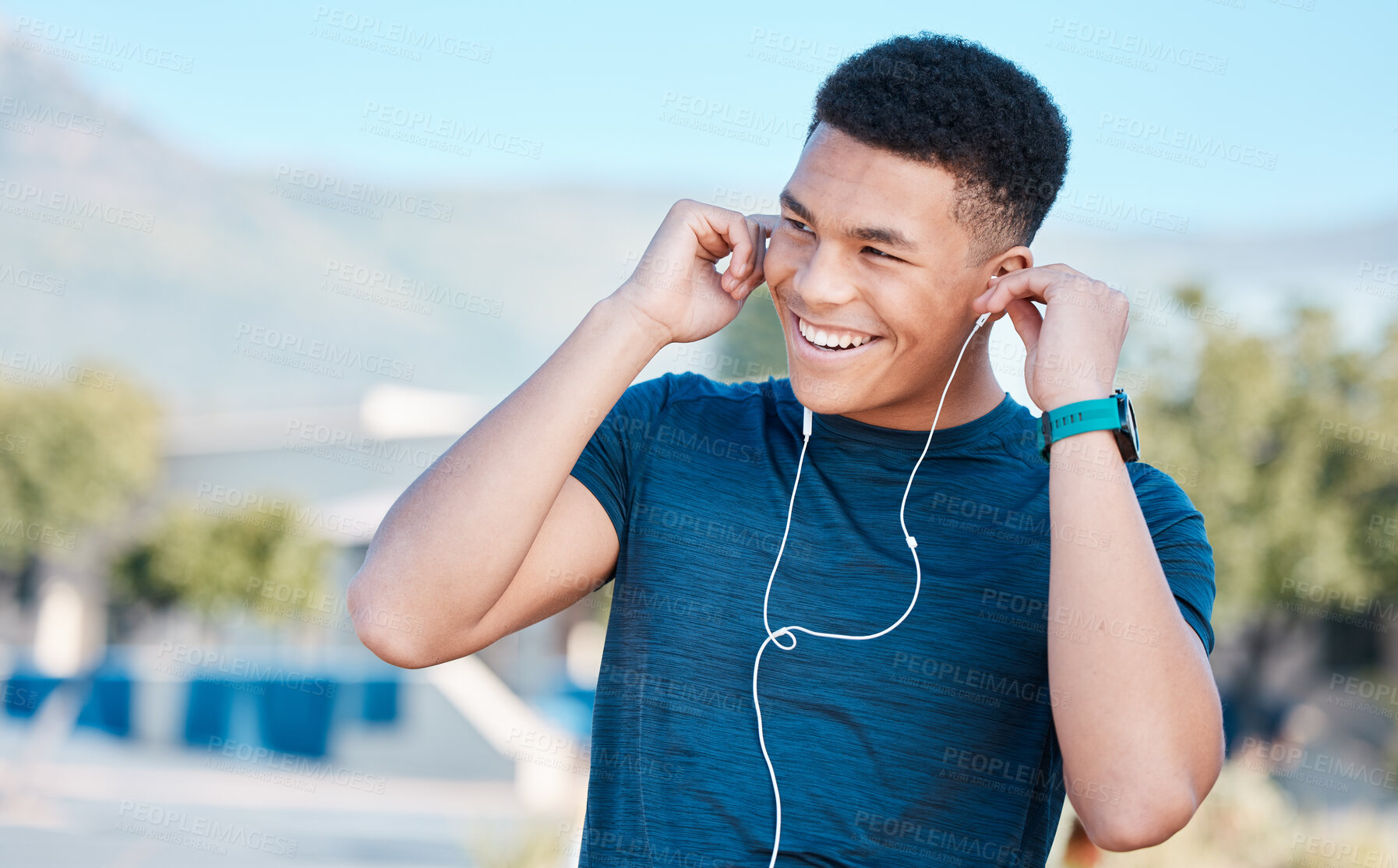 Buy stock photo Music, fitness and man ready for running, exercise, and workout in the city of Brazil. Motivation, happy and young runner listening to a podcast, audio or radio to start training in the morning