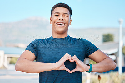 Portrait, heart hands and fitness man for self care, cardiology wellness and workout health support in outdoor running. Sports person or athlete with love emoji or sign in street training or wellness