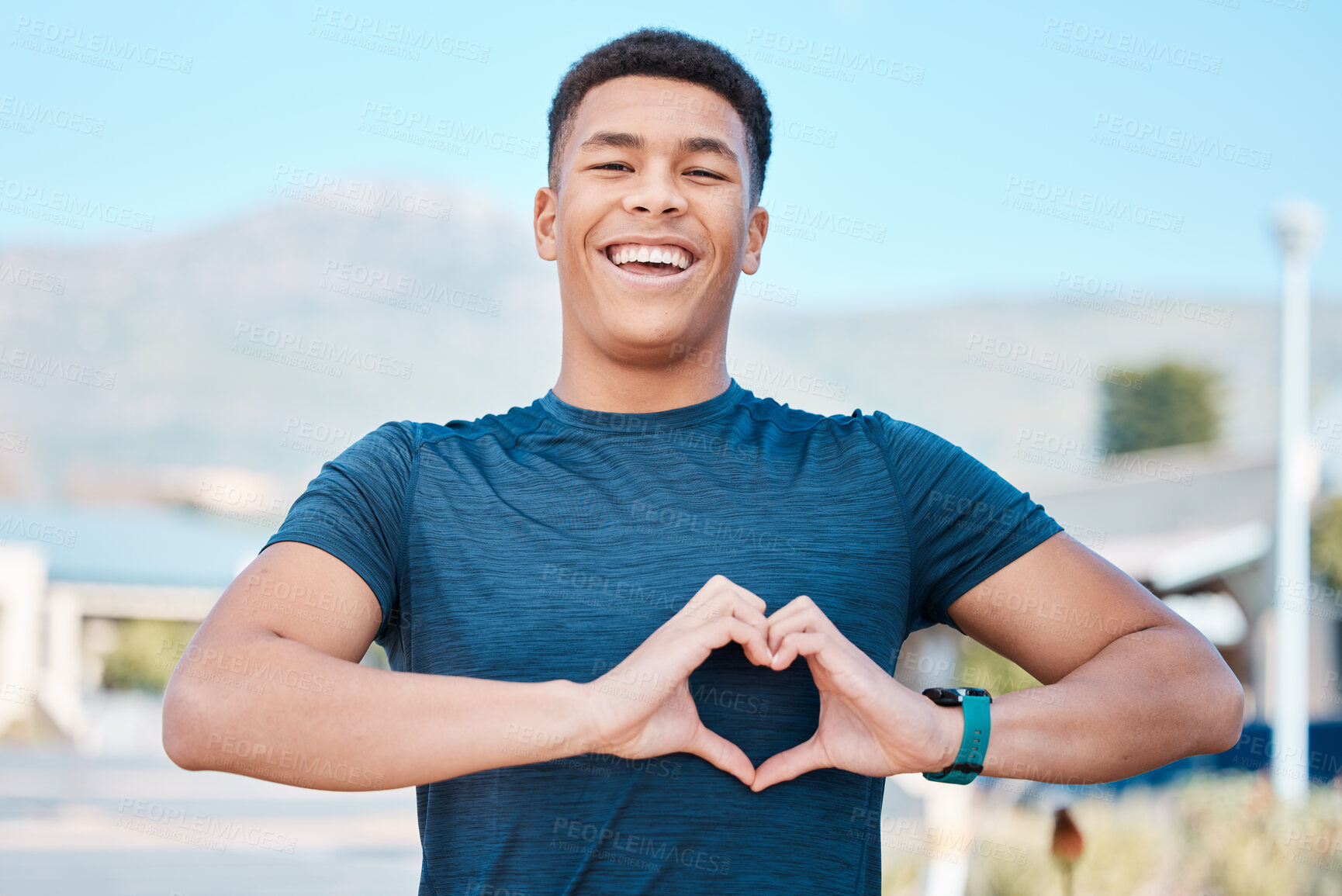 Buy stock photo Portrait, heart hands and fitness man for self care, cardiology and workout health support in outdoor running. Face of sports person or athlete with love emoji or sign in street training or wellness