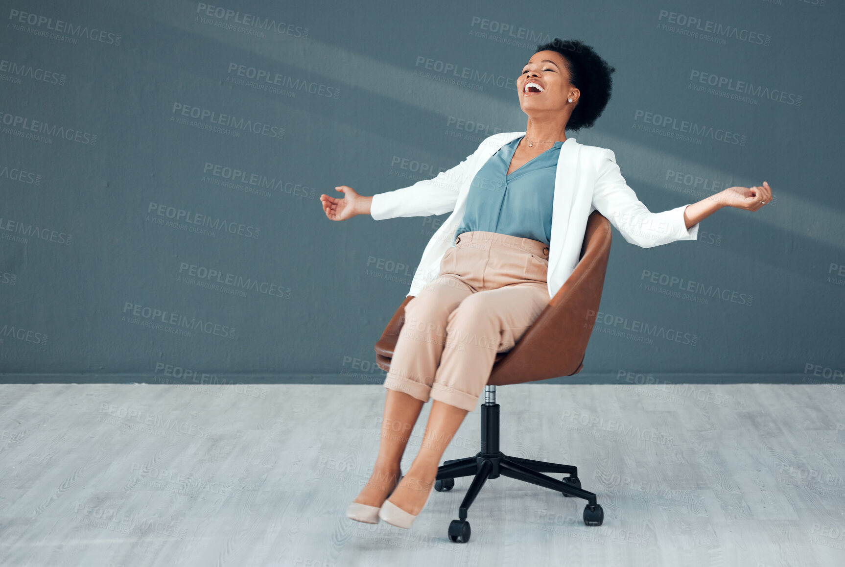 Buy stock photo Chair, carefree and mockup with a business black woman sliding on the floor of her office feeling stress free. Freedom, relax and success with a crazy female employee riding a seat in the workplace