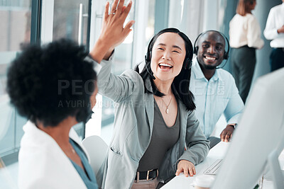 Buy stock photo Success, teamwork and high five with asian woman in call center for customer support, contact us and communication. Winner, goals and target with people in office for deal, consulting and help desk 