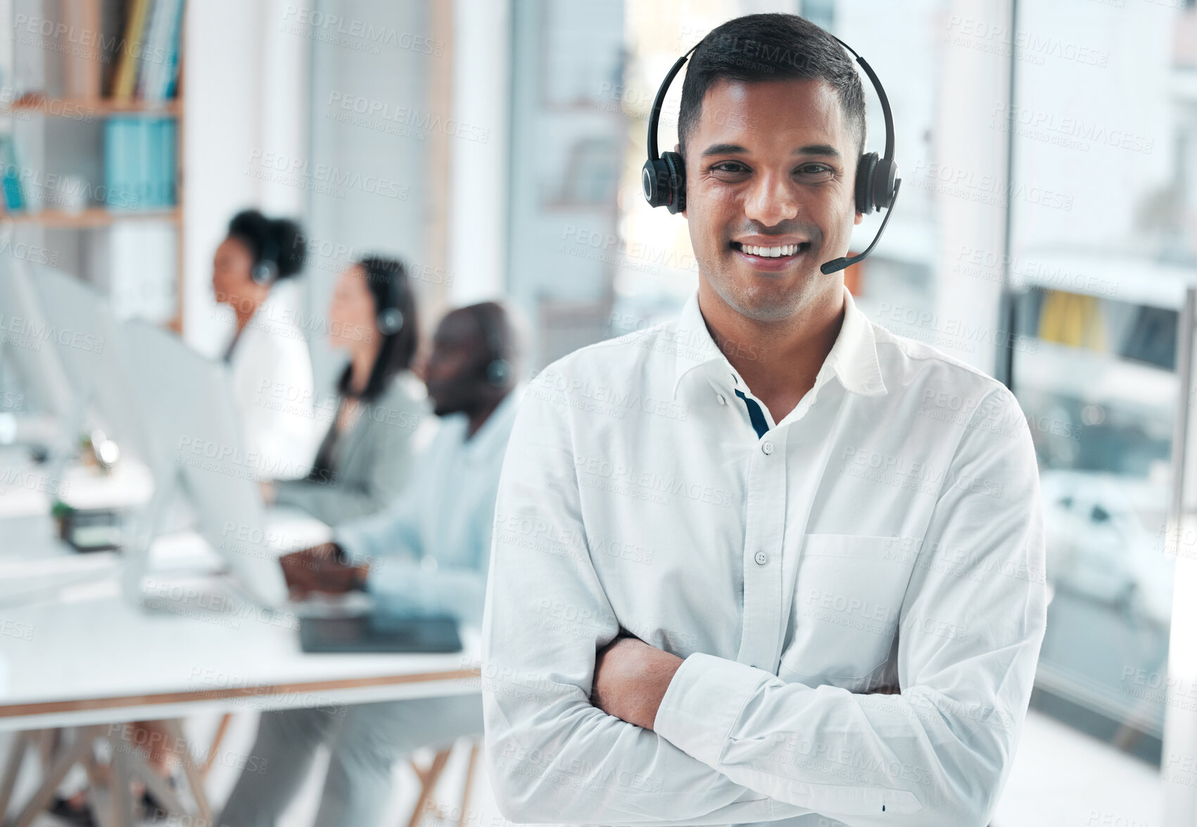 Buy stock photo Crm, manager or portrait of man in call center smiles with pride, helping advice or networking online. Face, smile or happy Indian insurance agent in communication at customer services or sales job 