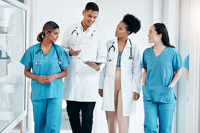 Buy stock photo Doctor walkings, hospital tablet and healthcare talking and consulting with data. Teamwork, nurse collaboration and doctors in a wellness and health clinic with nurses discussion and diversity