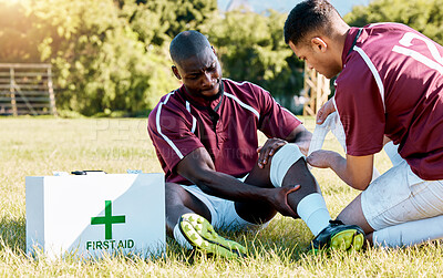 Buy stock photo First aid, sport and black man with medic after an accident, knee pain and rugby injury. Healthcare, help and African athlete crying after a hurt muscle in sports with a doctor for medical attention